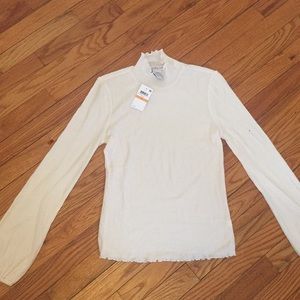 White mock neck long sleeve shirt